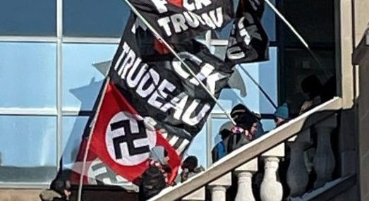 Was the Freedom Convoy masked Nazi flag-waver a Liberal lobbyist and PR ...